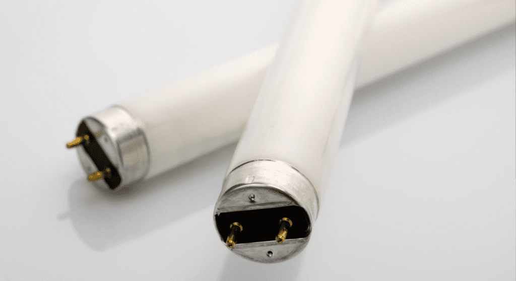 Two white tube shaped fluorescent bulbs